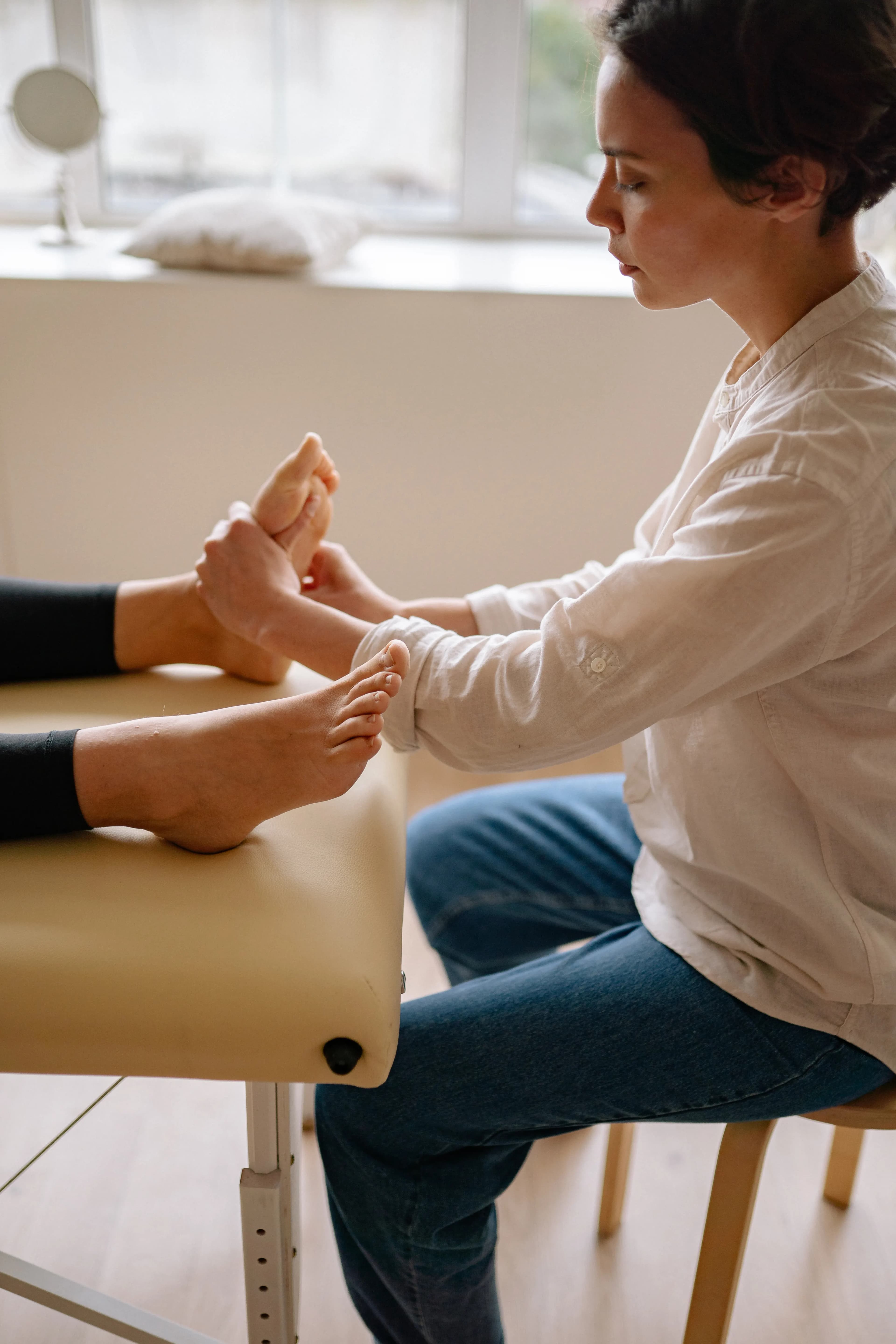 A therapist giving a relaxing foot massage